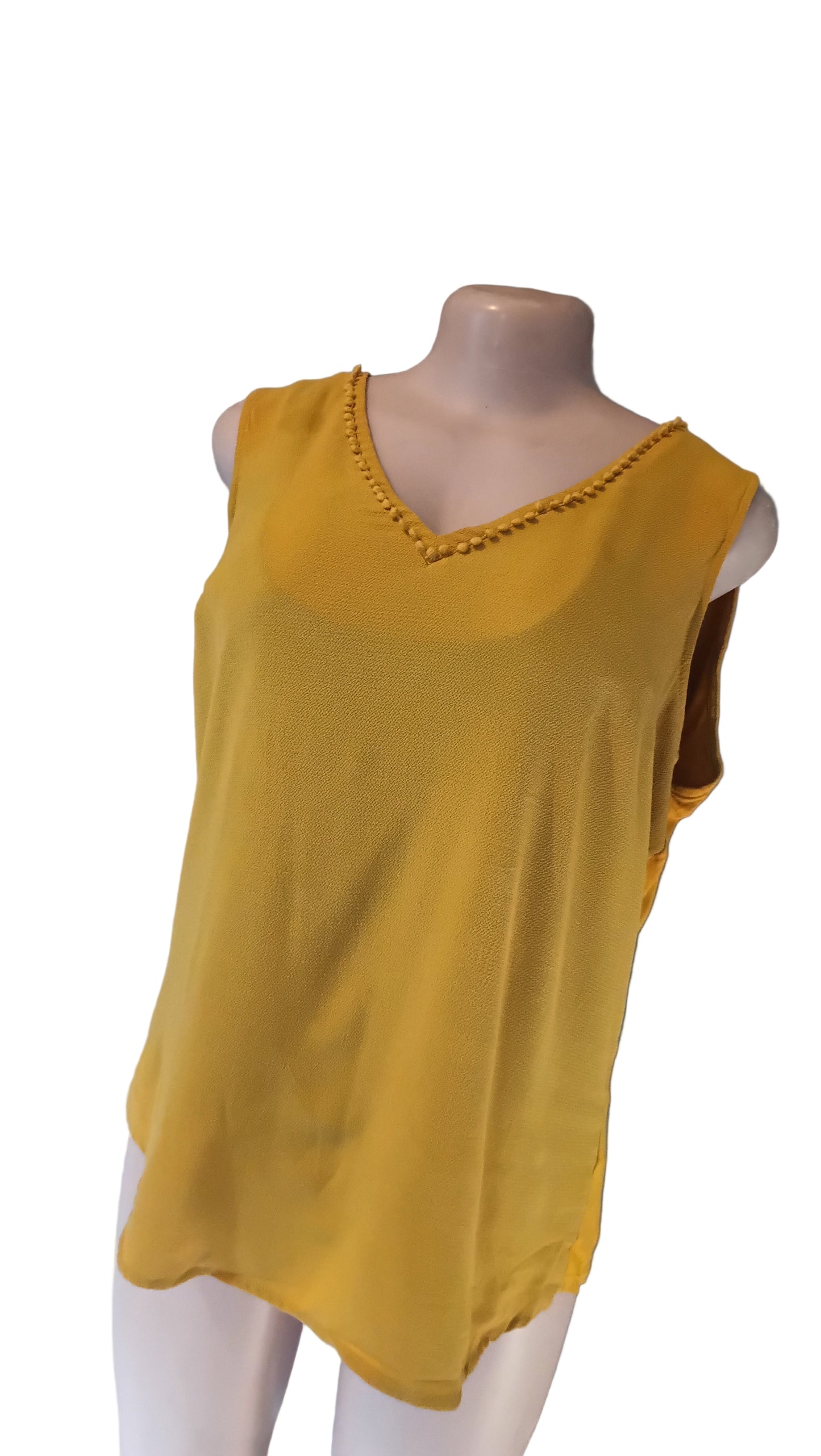 Sleeveless gold blouse